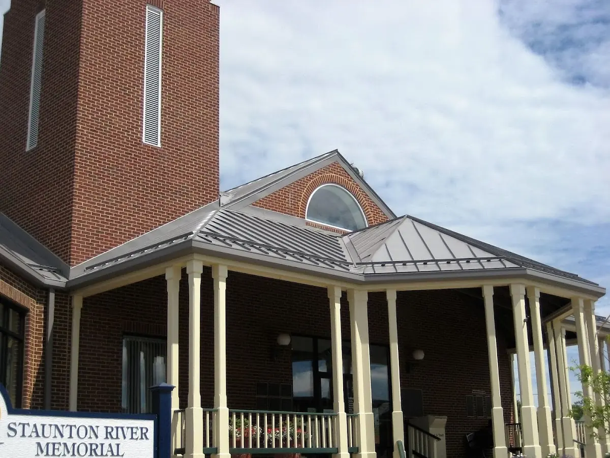 Skilled roofing craftsmen working on a residential roof in Denville